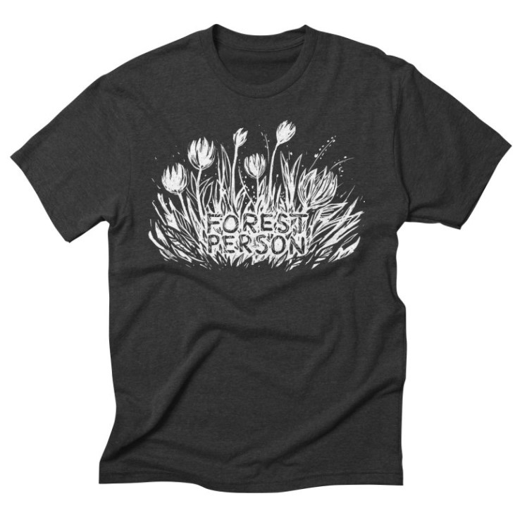 Grass and flowers with the text "Forest Person" on a t-shirt.